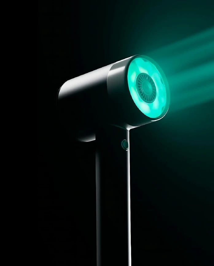 Masajeador capilar con luz roja.